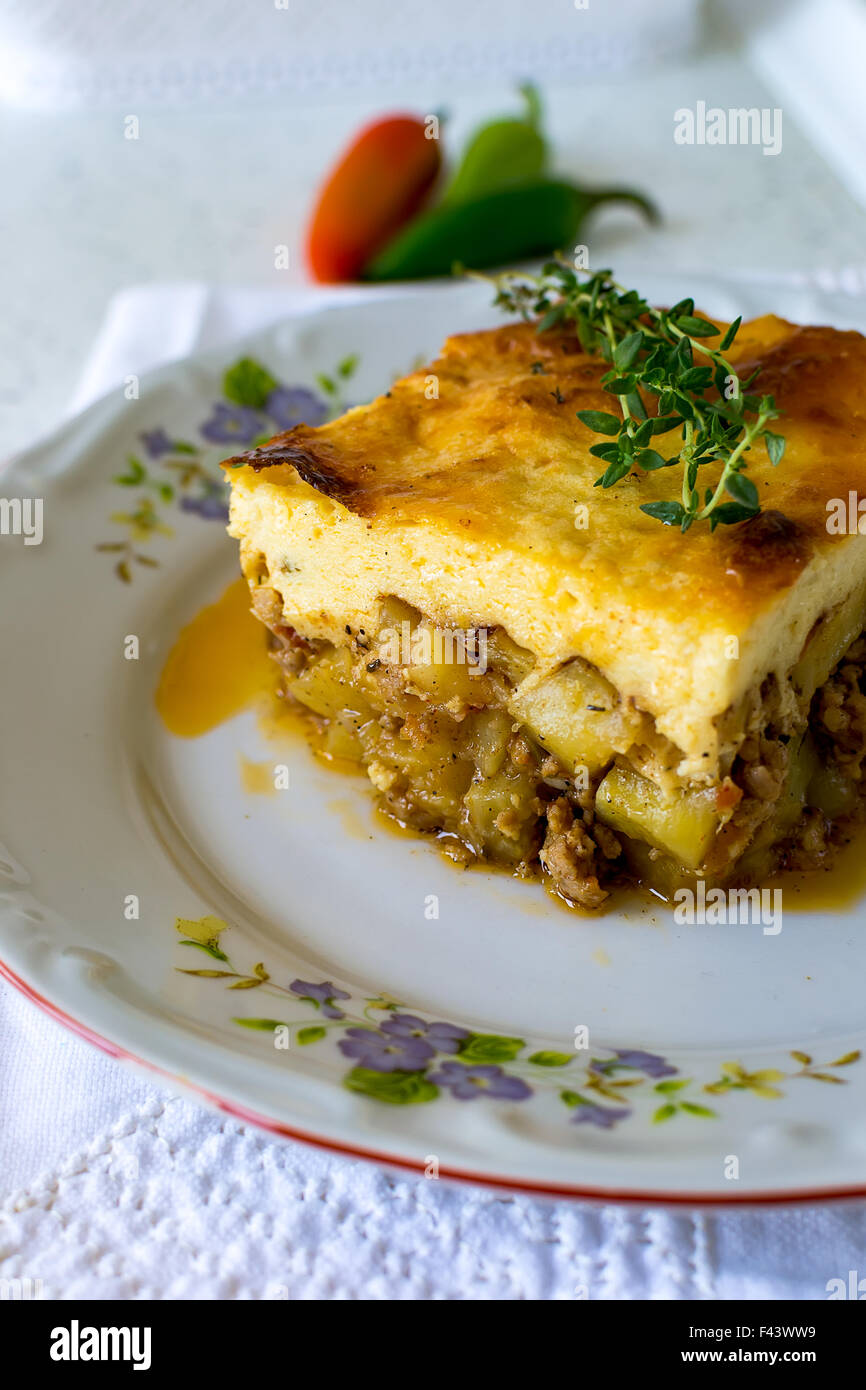 Bulgarian moussaka with potatoes and mince and top with toasted mixture