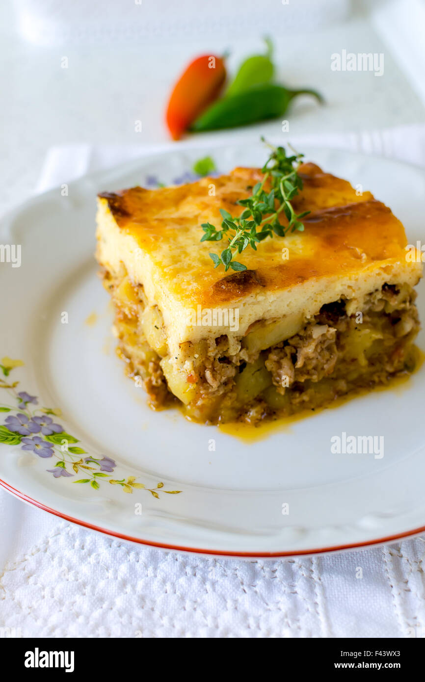 Bulgarian moussaka with potatoes and mince and top with toasted mixture