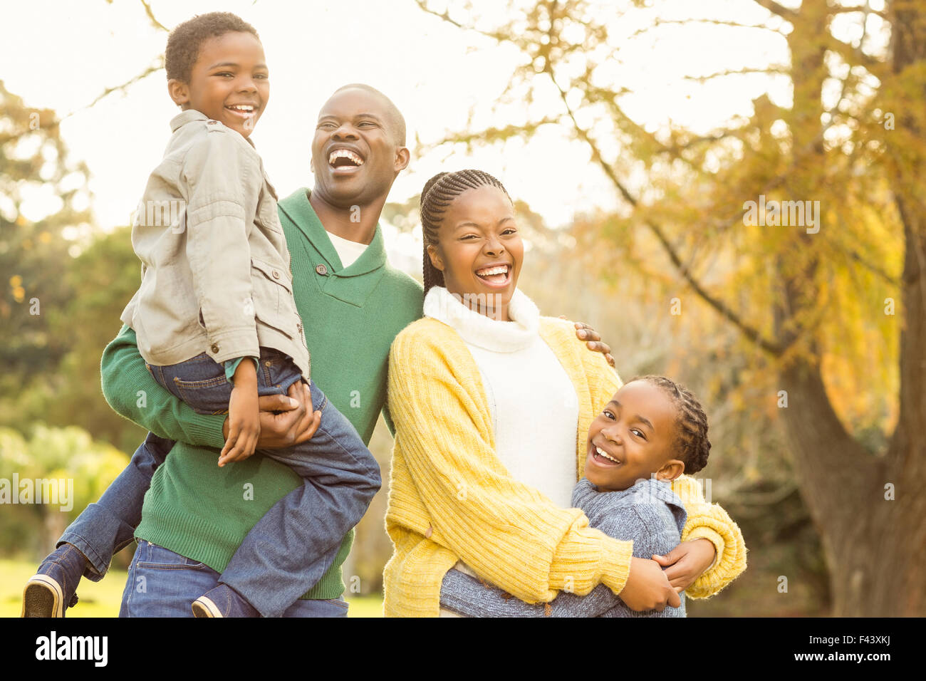 Portrait of a smiling young family laughing Stock Photo