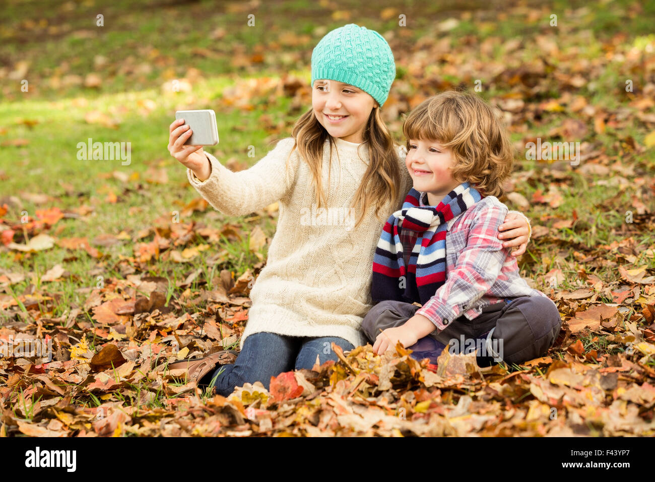 Happy siblings in the park Stock Photo