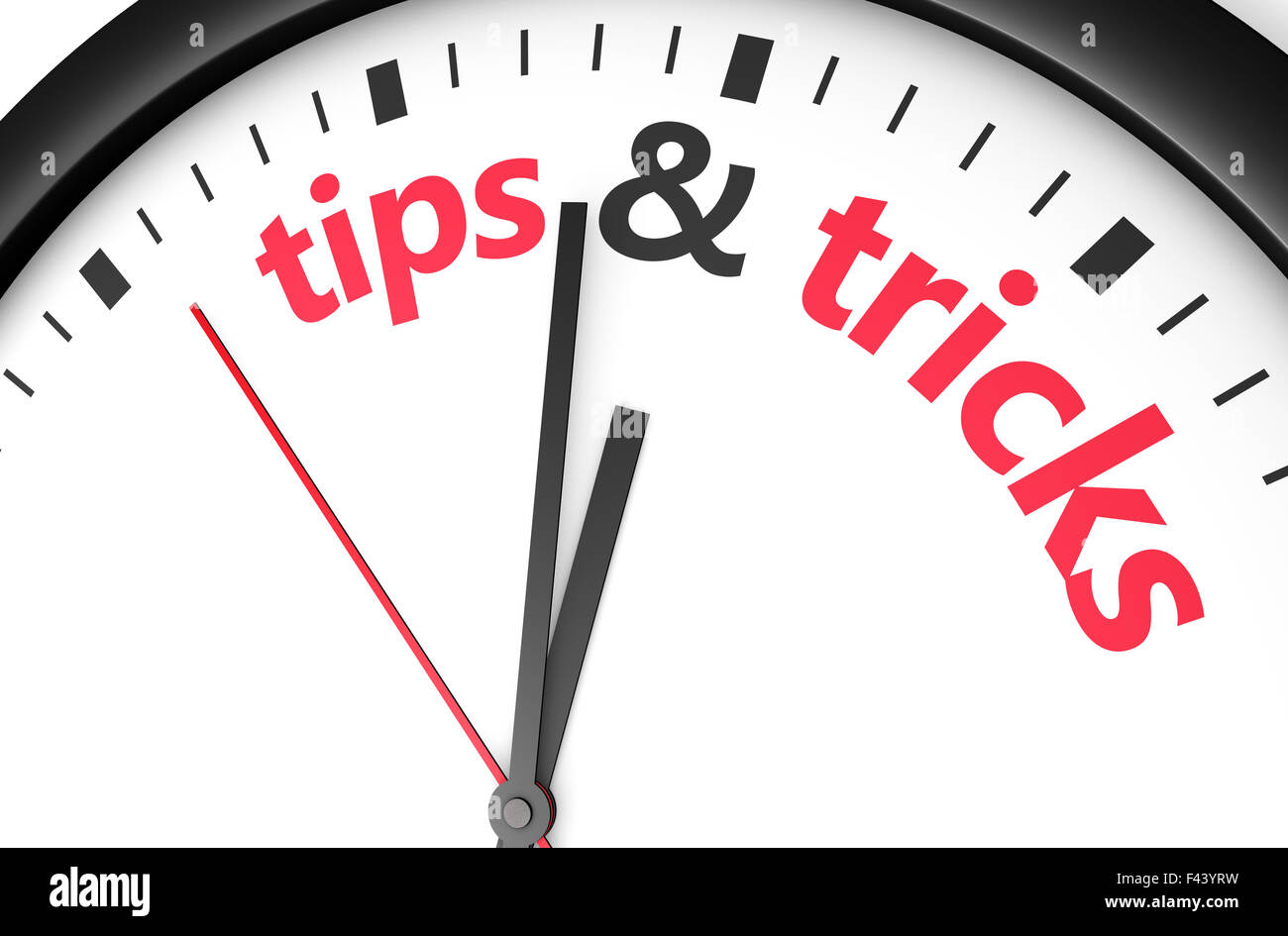 Time for tips and tricks concept with red word and sign printed on a clock face. Stock Photo