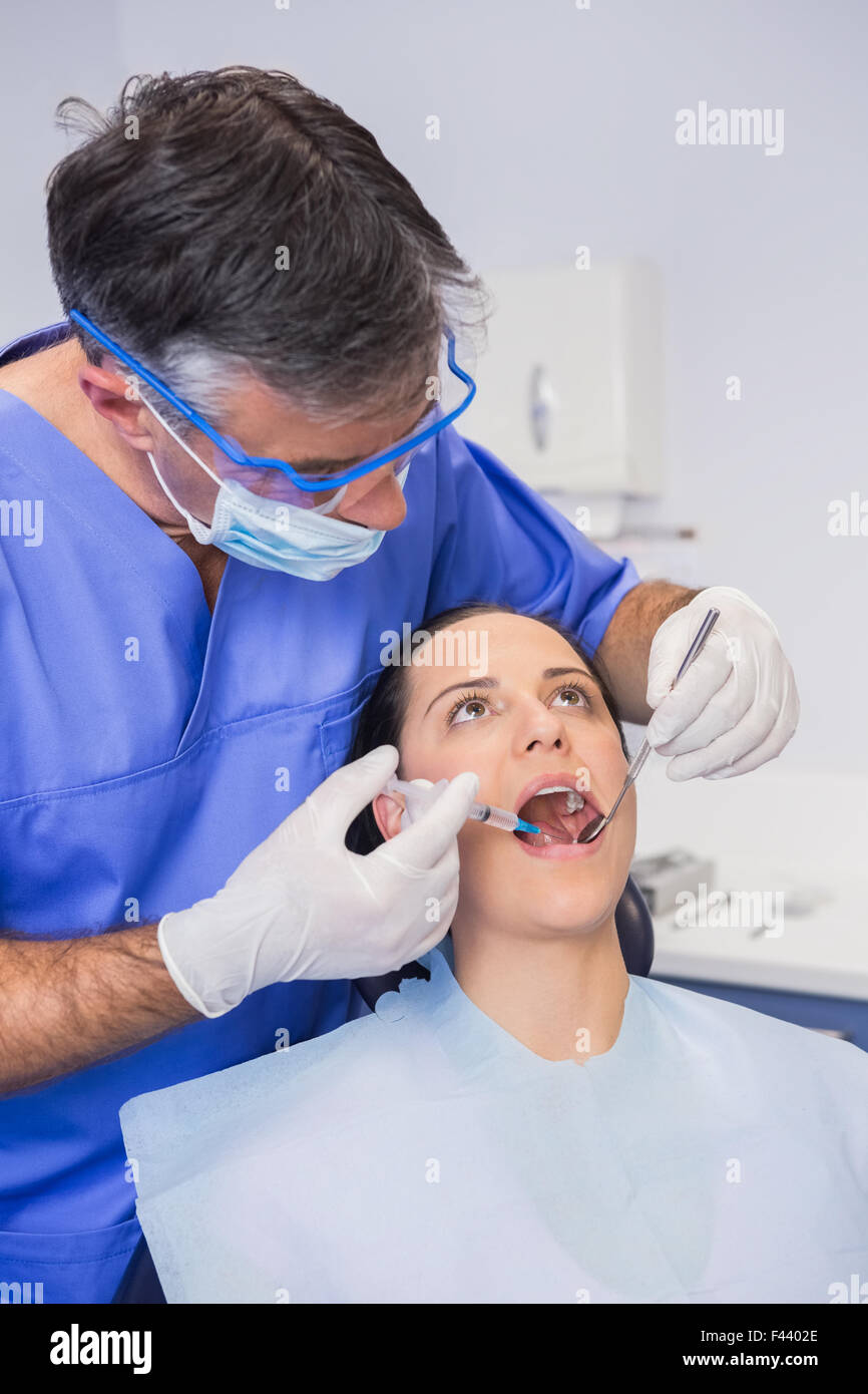 Dentist doing injection to his patient Stock Photo Alamy
