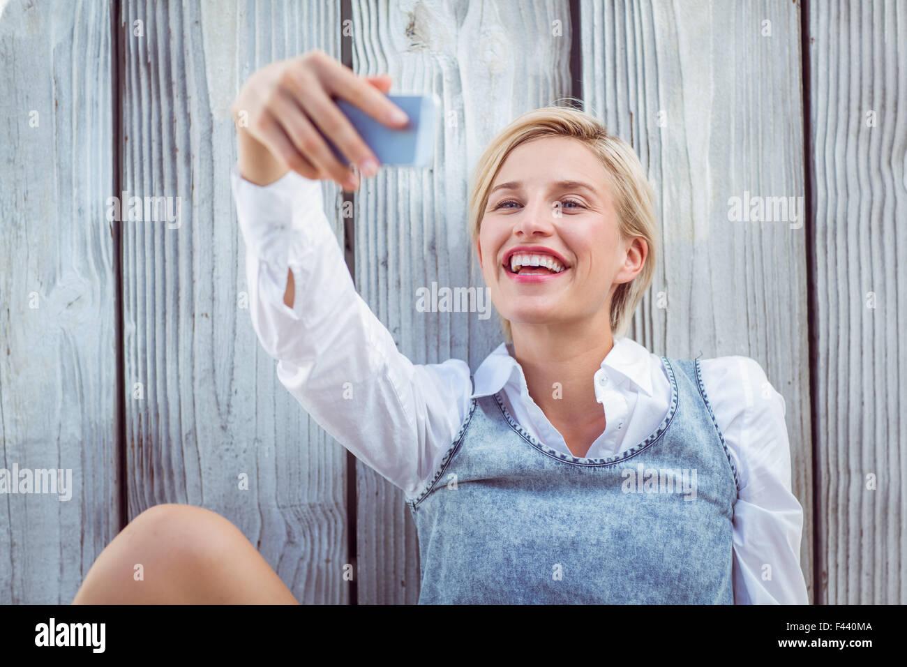 Pretty blonde woman taking selfie Stock Photo - Alamy