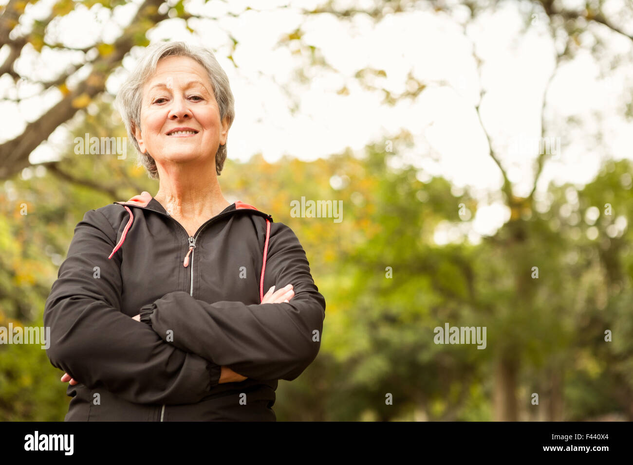 Senior woman in the park Stock Photo - Alamy