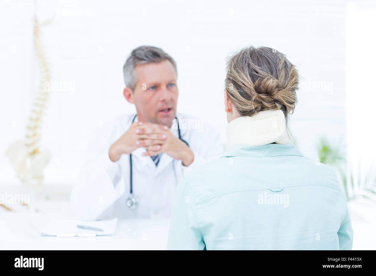 Doctor having conversation with his patient Stock Photo - Alamy