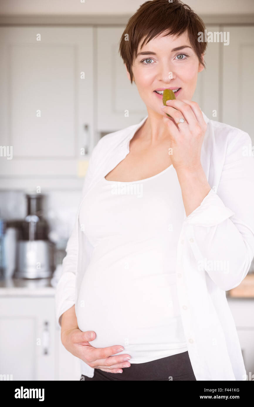 Pregnant woman eating jar of pickles Stock Photo Alamy