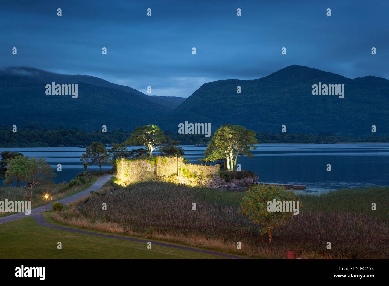 Twilight over McCarthy Mor Castle ruins and Lough Leane, Killarney, County Kerry, Republic of Ireland Stock Photo