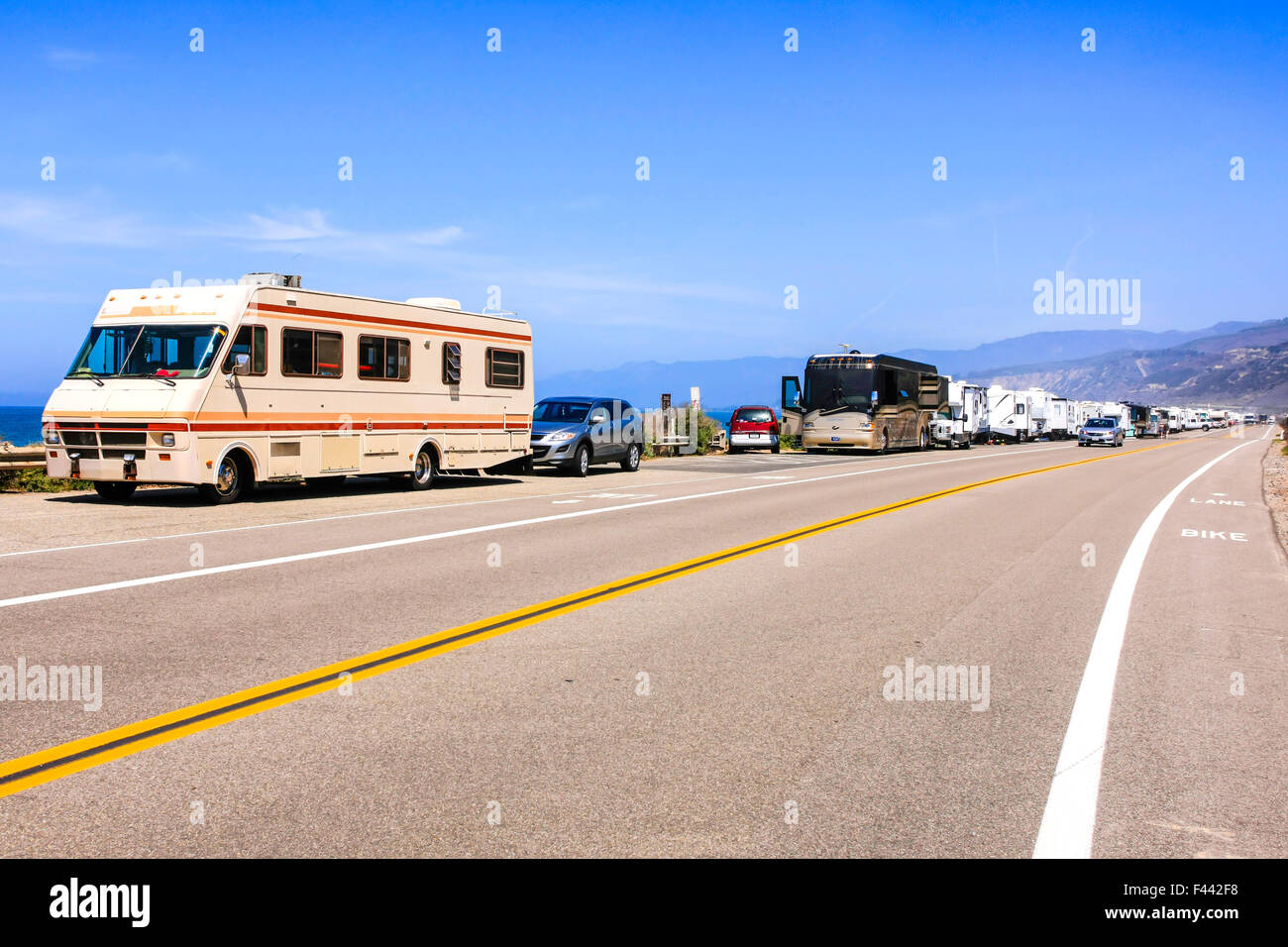 Motorhomes and travel trailers parked up on PCH Pacific Coast Highway