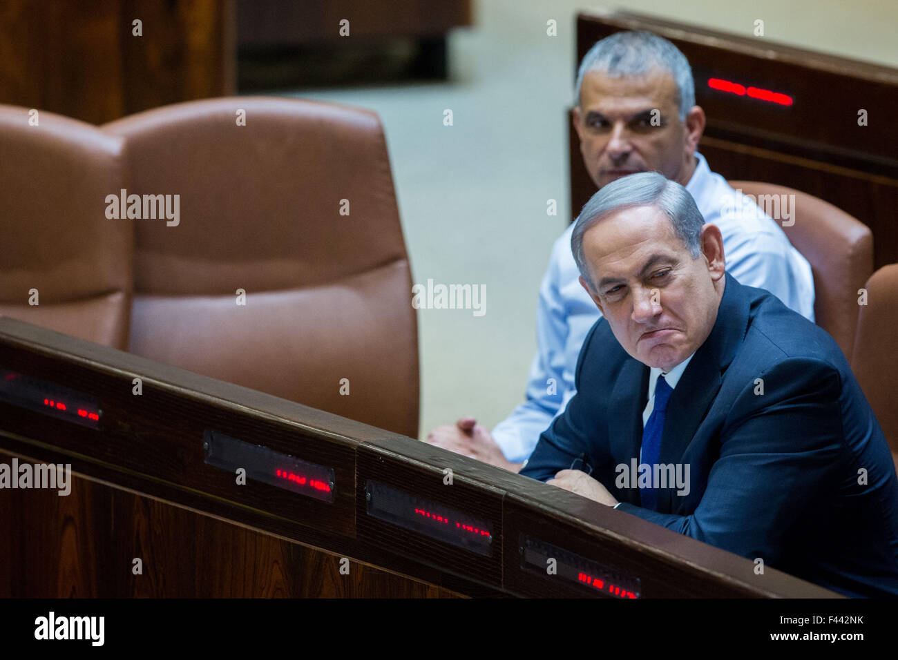 (151014) -- JERUSALEM, Oct. 14, 2015 (Xinhua) -- Israeli Prime Minister Benjamin Netanyahu (R) attends a special session at the Knesset (Israeli parliament) in Jerusalem, on Oct. 14, 2015. Israeli Prime Minister Benjamin Netanyahu is pushing for more security measures to fight a rising wave of violence, amid one of the most lethal days of attacks against Israelis in the past month. Netanyahu convened his top brass of ministers, a forum known as the security cabinet, to discuss further measures to curtail the wave of terror attacks, with right wing ministers pushing for a closure on Palestinian Stock Photo