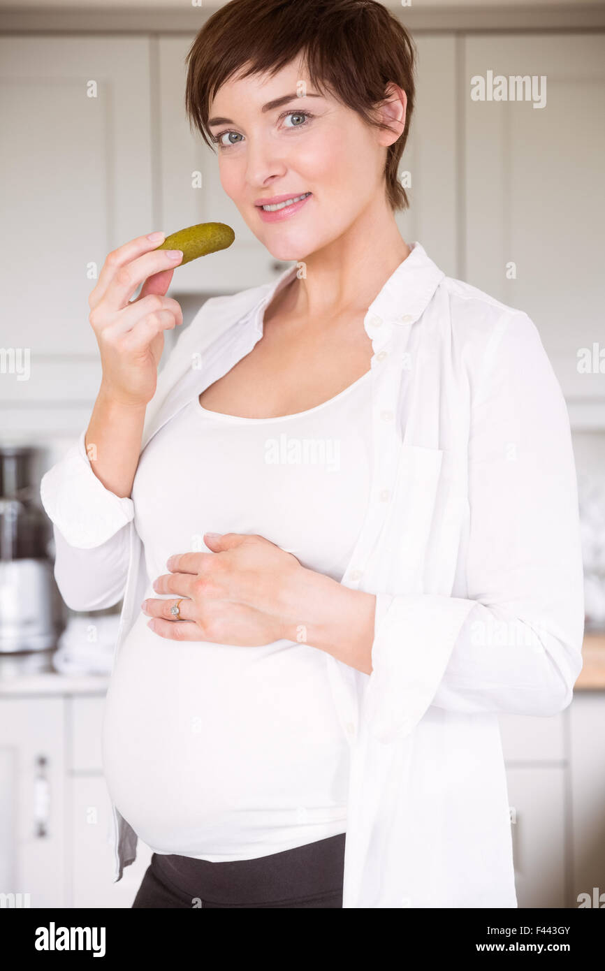 Pregnant woman eating jar of pickles Stock Photo Alamy