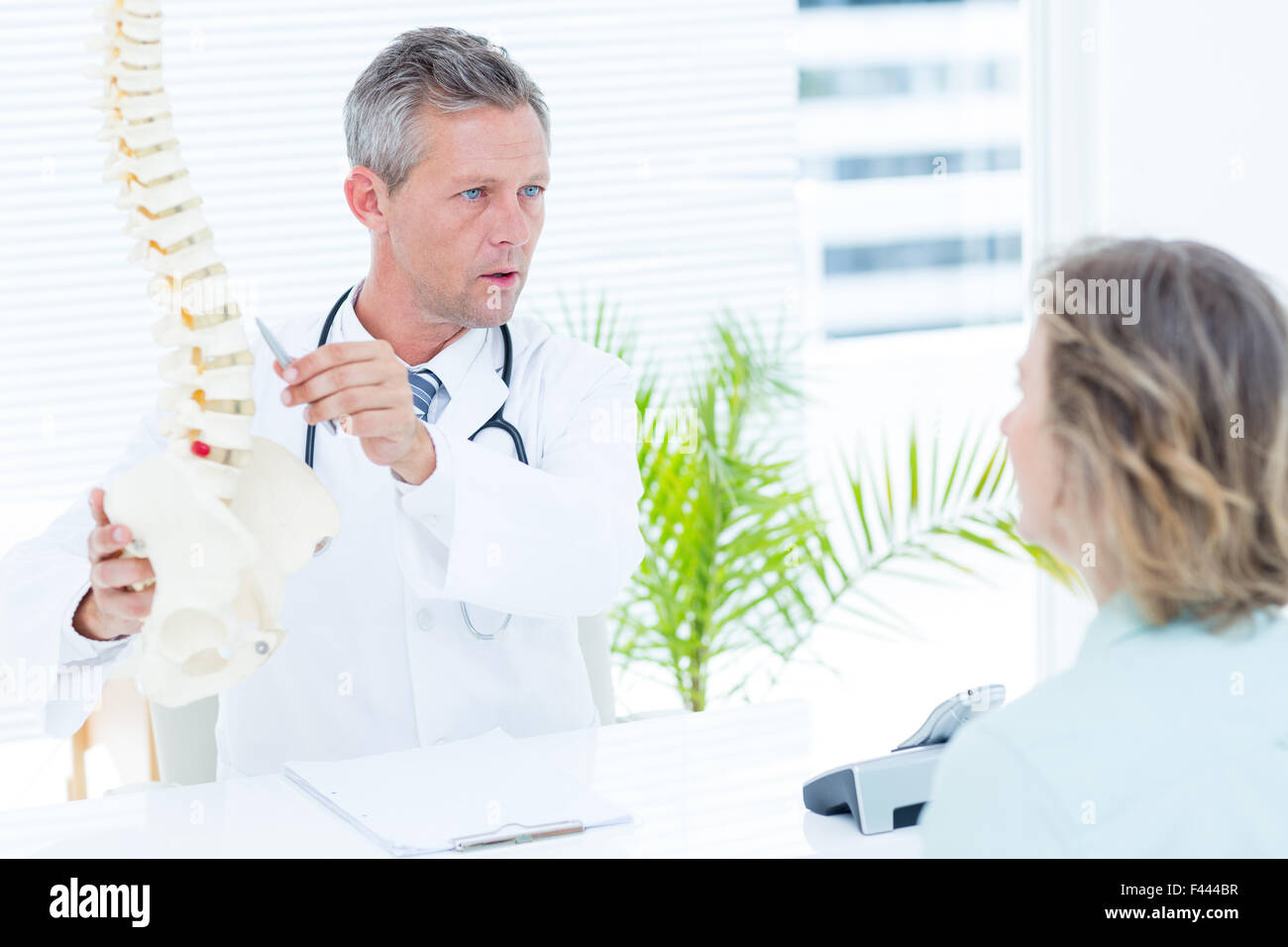 Doctor having conversation with his patient Stock Photo - Alamy