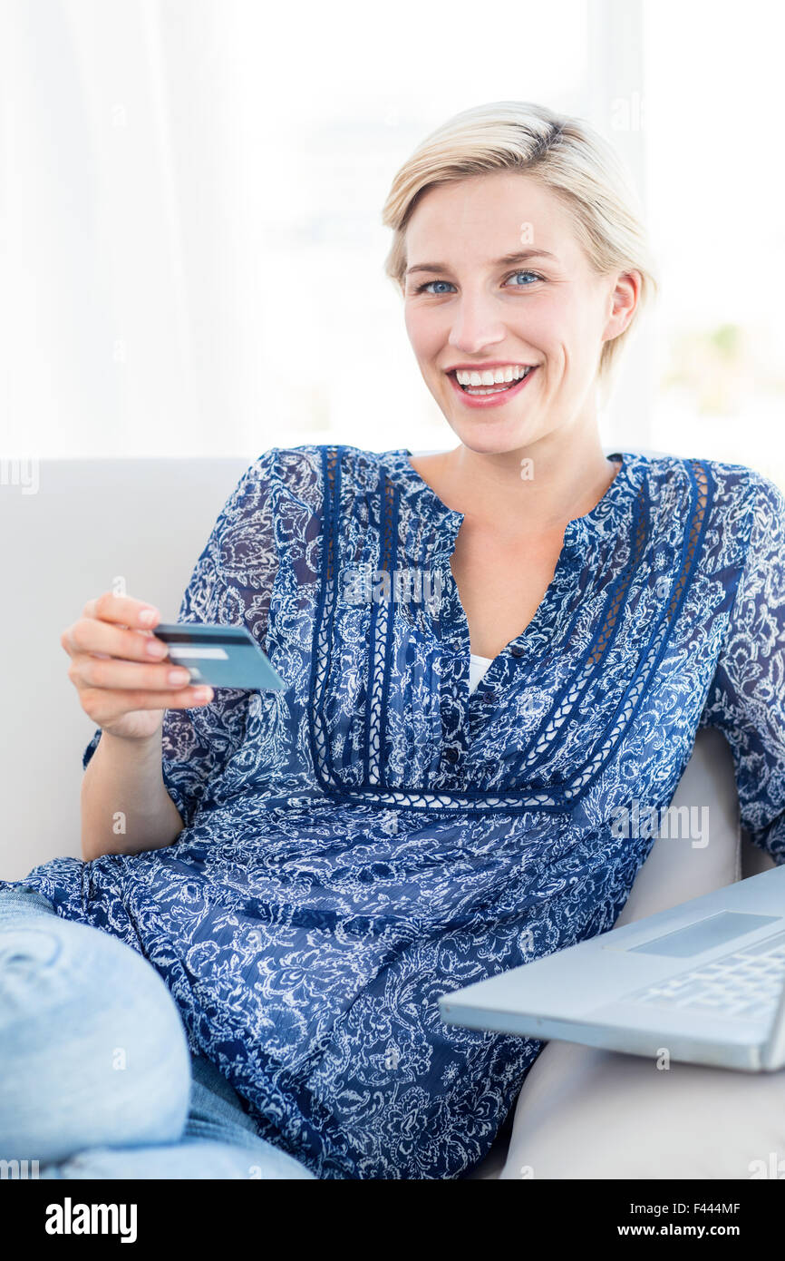 Pretty blonde woman doing online shopping Stock Photo