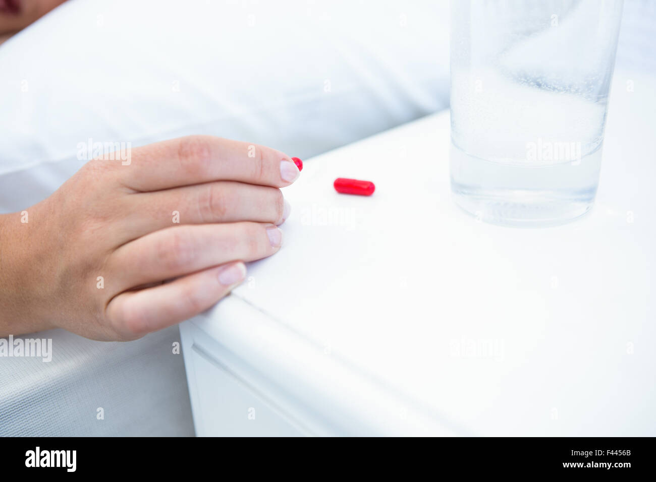 Woman taking pills before sleeping Stock Photo Alamy