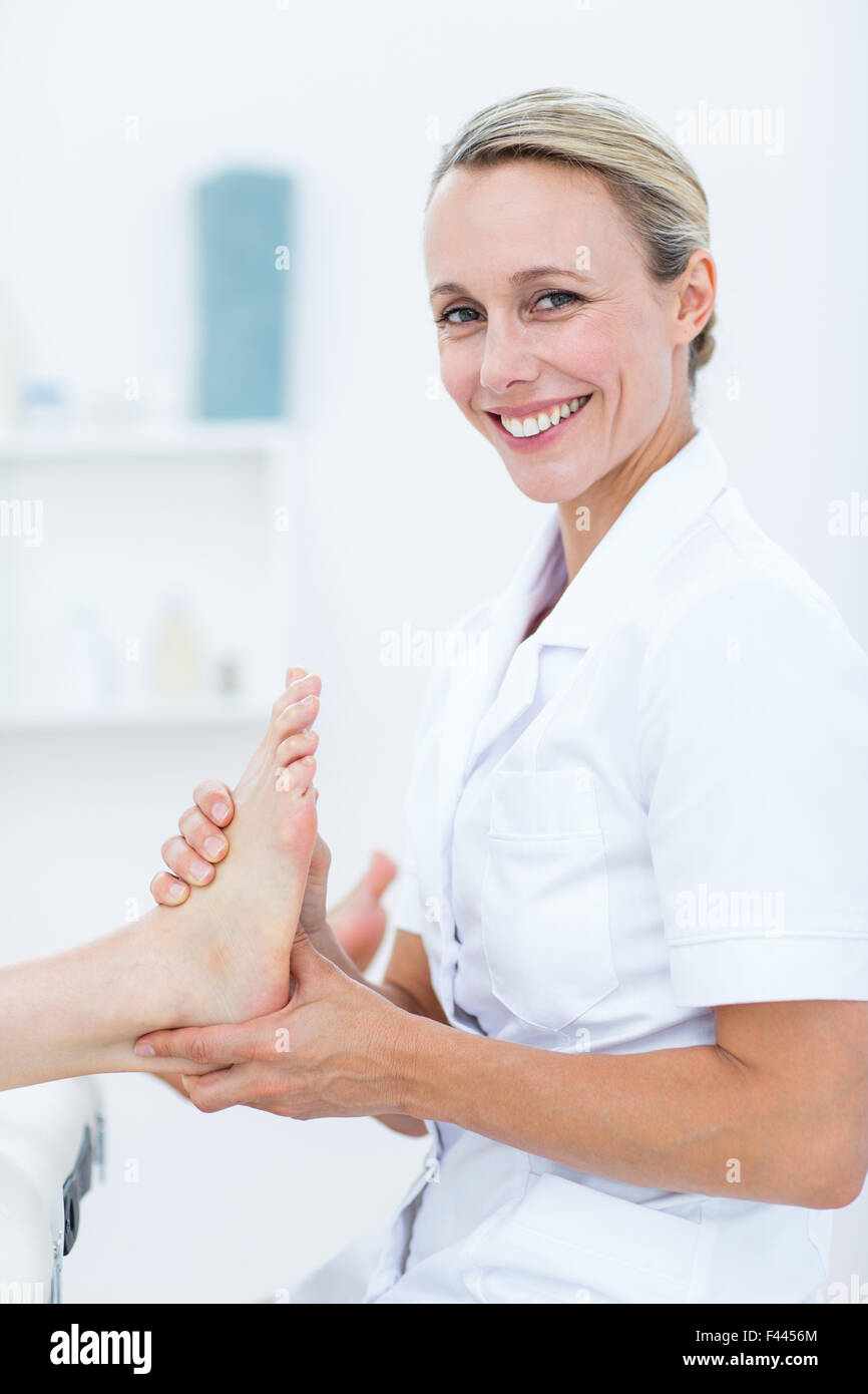 Physiotherapist doing foot massage Stock Photo Alamy