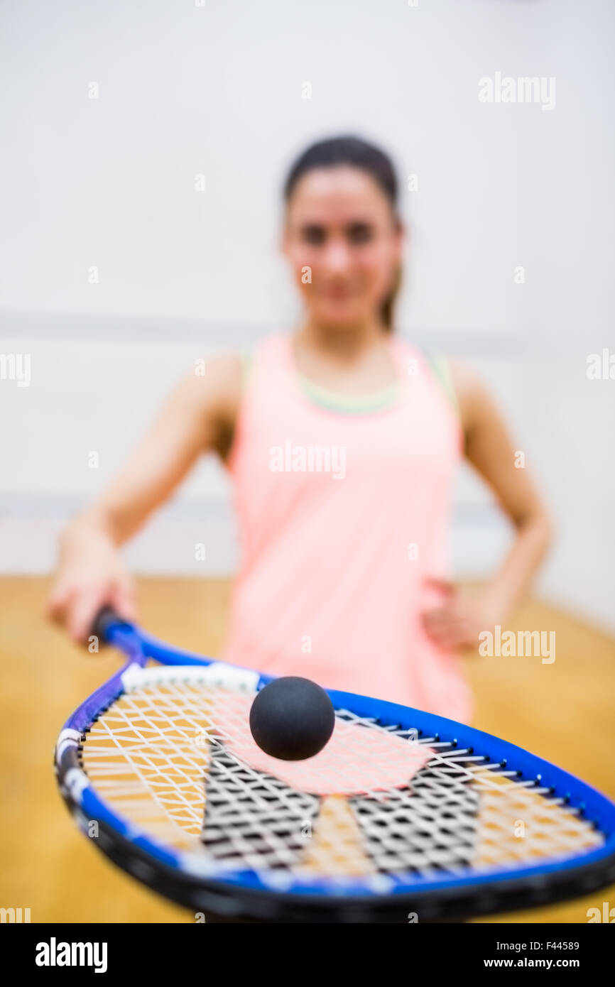 Woman balancing a ball on her racket Stock Photo