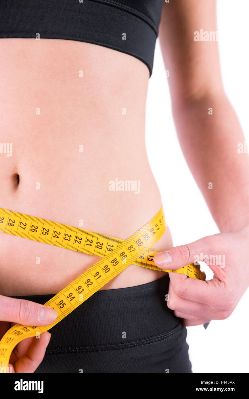 Slim woman measuring waist with tape measure Stock Photo Alamy