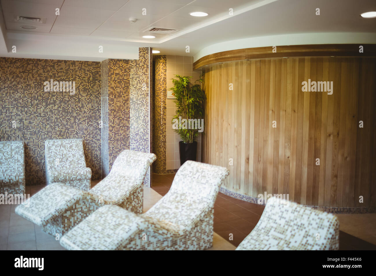 Multiple stone chairs in the sauna suite Stock Photo