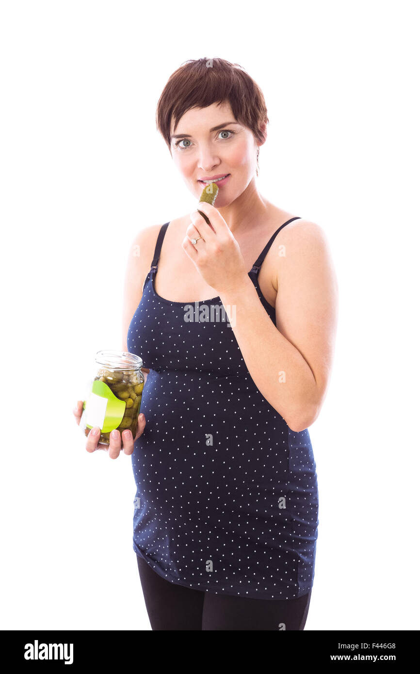 Pregnant woman eating jar of pickles Stock Photo Alamy