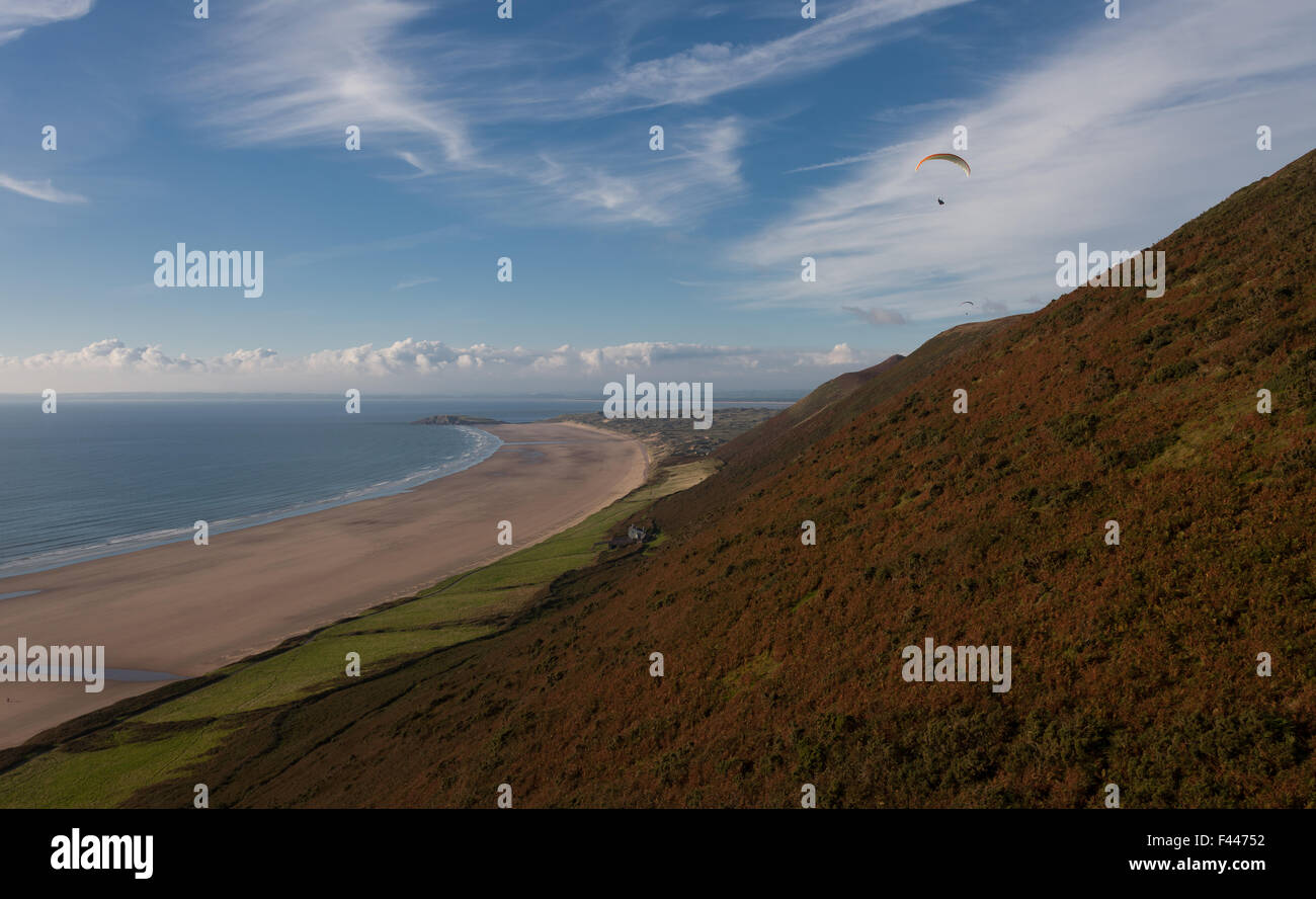 Paragliding from Rhossili Downs on the Gower peninsular, South Wales. Stock Photo