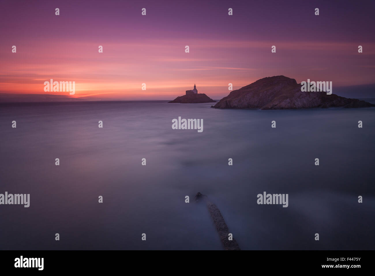 Dawn over Mumbles Lighthouse, Swansea Stock Photo