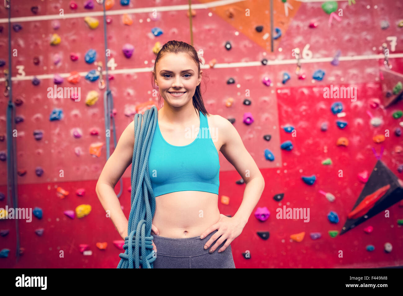 Fit woman at the rock climbing wall Stock Photo - Alamy
