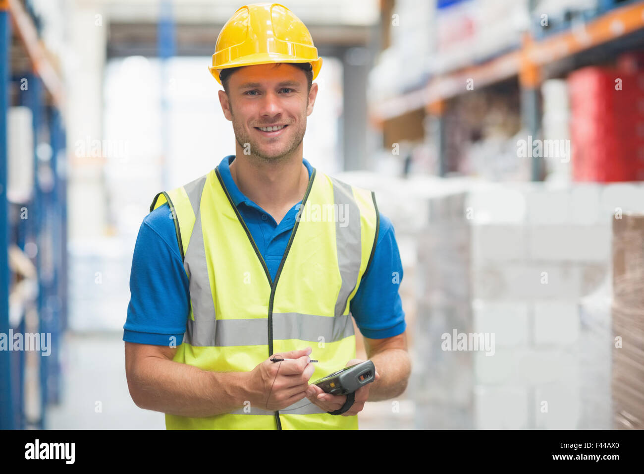 Worker using hand held computer Stock Photo Alamy