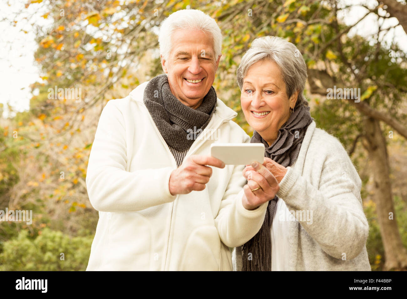 Senior couple in the park Stock Photo - Alamy