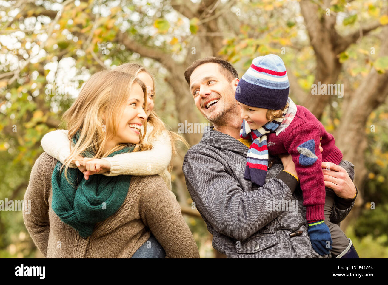 Smiling young family looking each other Stock Photo