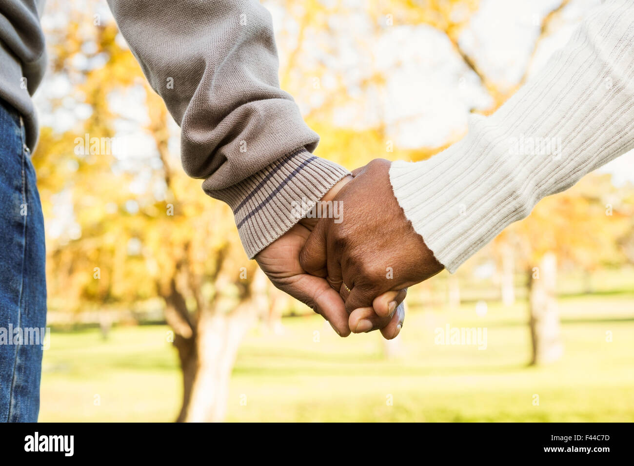 Close up view of senior couple holding hands Stock Photo