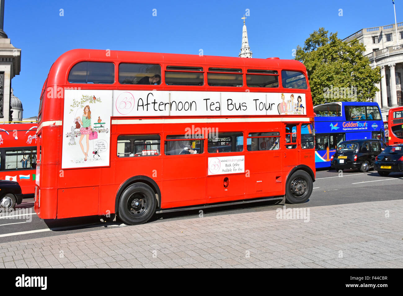 "Afternoon Tea" tour onboard the iconic London double decker red Routemaster bus seen in Trafalgar Square London England UK Stock Photo
