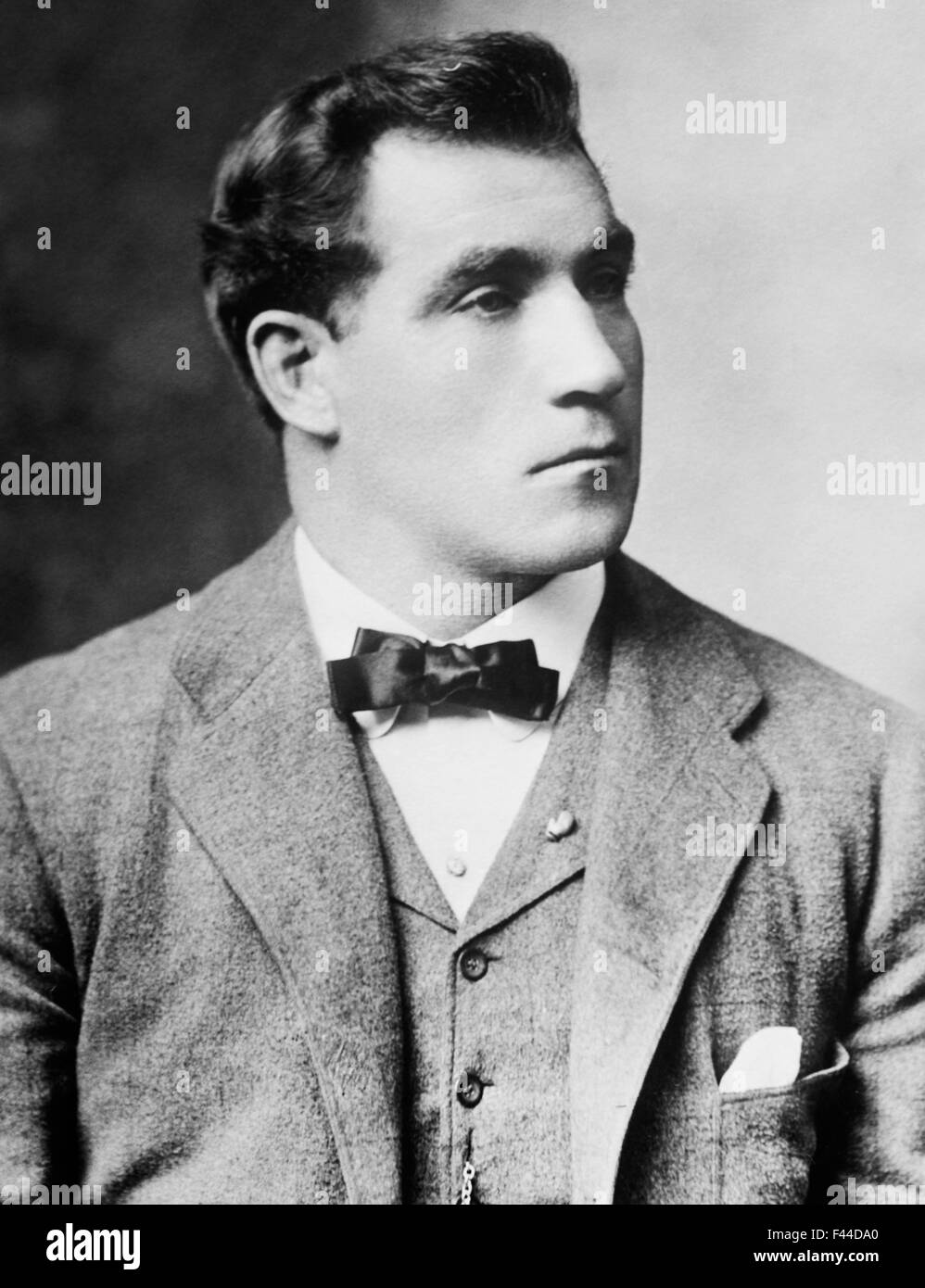 Vintage portrait photo of heavyweight boxer 'Sailor' Tom Sharkey (1873 - 1953). Sharkey, born in Dundalk, Ireland, ran away from home at a young age and went to sea as a cabin boy, eventually arriving in New York City in 1892 and joining the US Navy. He began his boxing career after being deployed to Hawaii and went on to have more than 50 bouts - fighting some of the great champions of the era including Jim Corbett, Bob Fitzsimmons and Jim Jeffries. Despite never winning the world heavyweight crown Sharkey is generally regarded as one of the great fighters of his time. Stock Photo