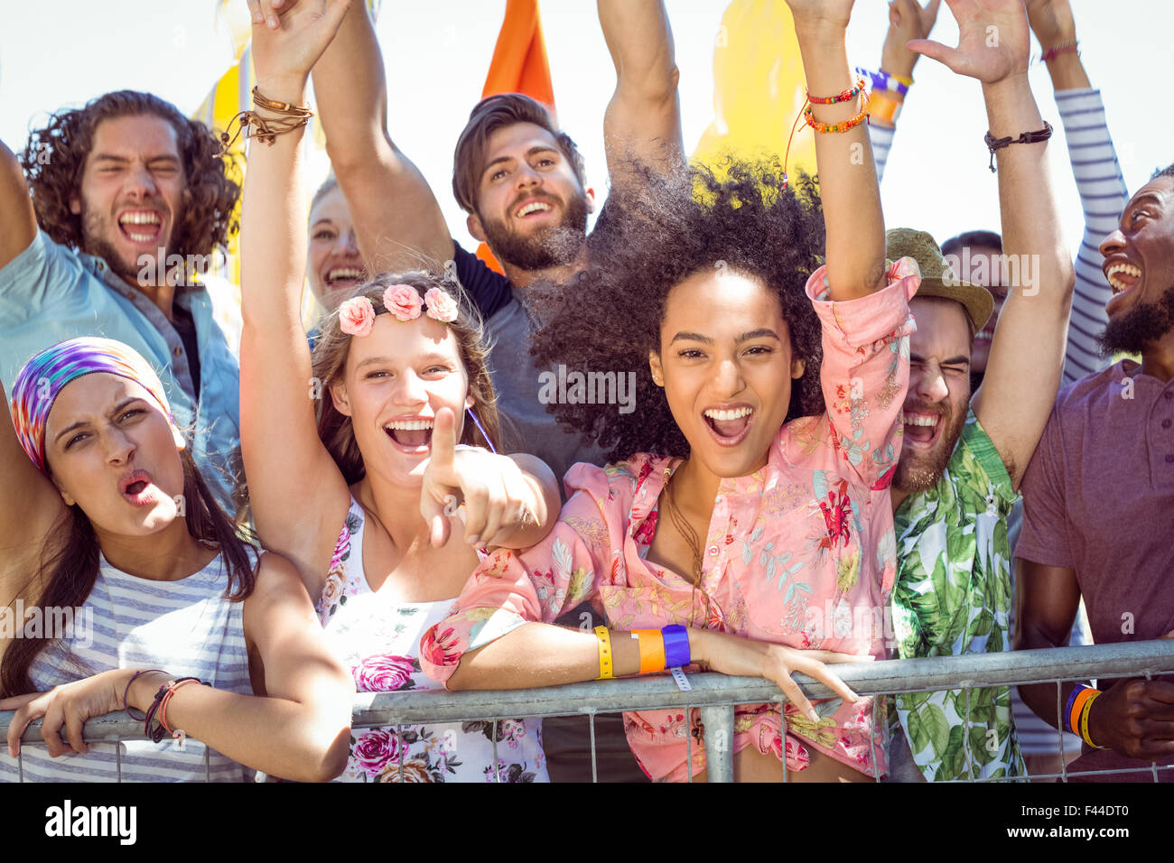 Excited young people singing along Stock Photo
