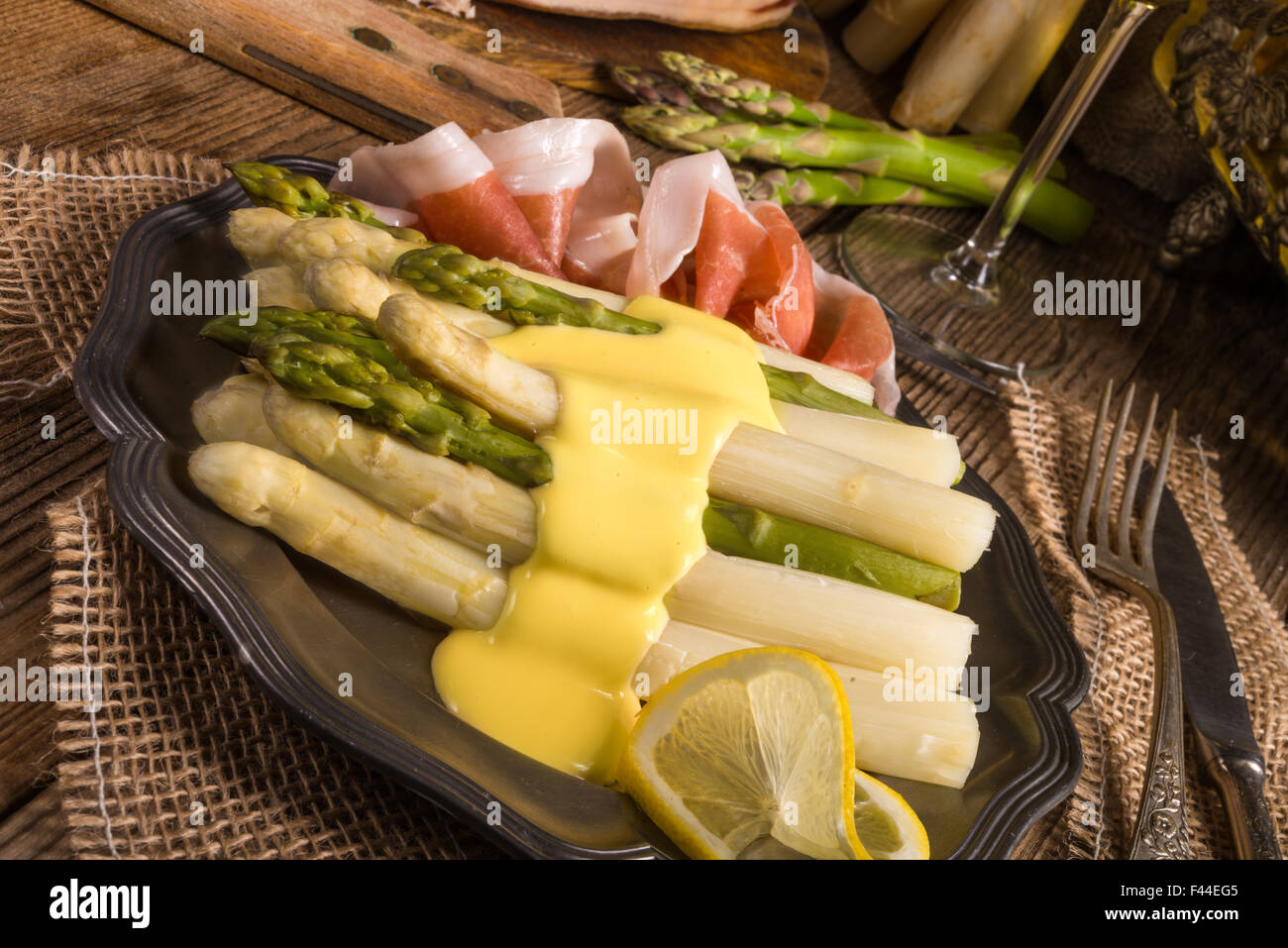 Asparagus with ham Stock Photo Alamy