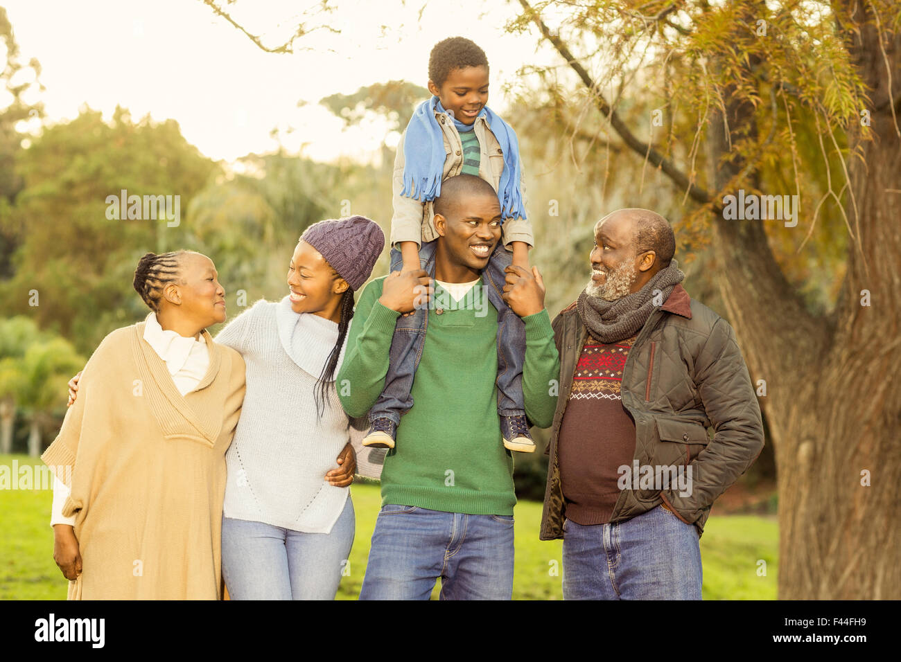 Extended family posing with warm clothes Stock Photo