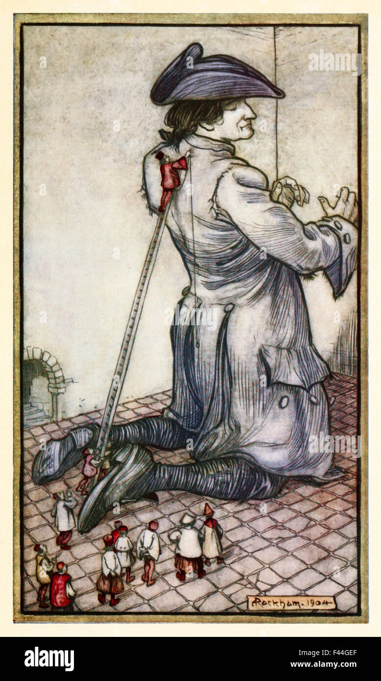 'The Lilliputian tailors measure Gulliver for a new suit of clothes' from 'Part I: A Voyage to Lilliput' in 'Gulliver's Travels' by Jonathan Swift (1667-1745), illustration by Arthur Rackham (1867-1939). See description for more information. Stock Photo