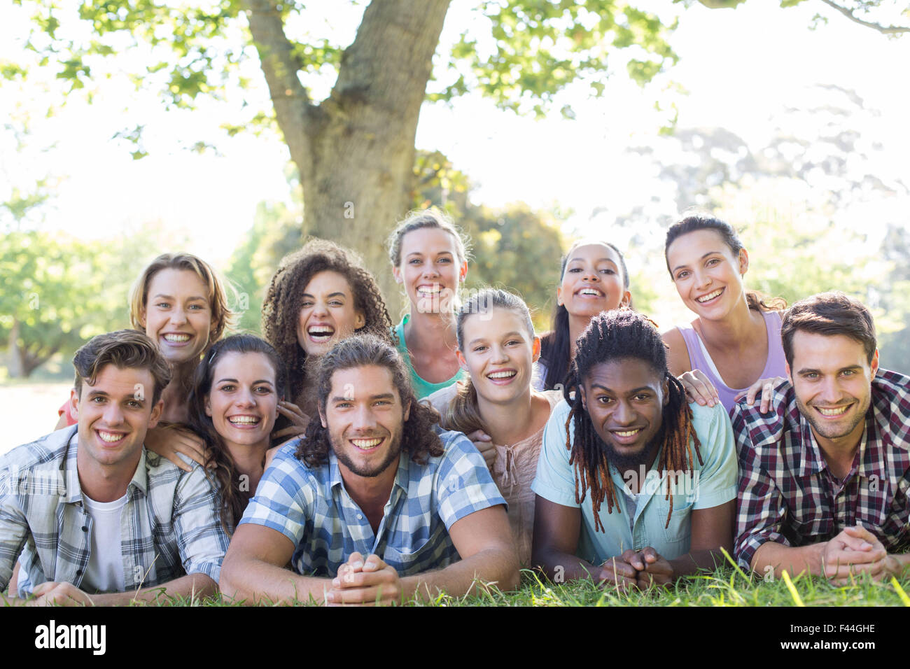 Happy friends in the park Stock Photo - Alamy
