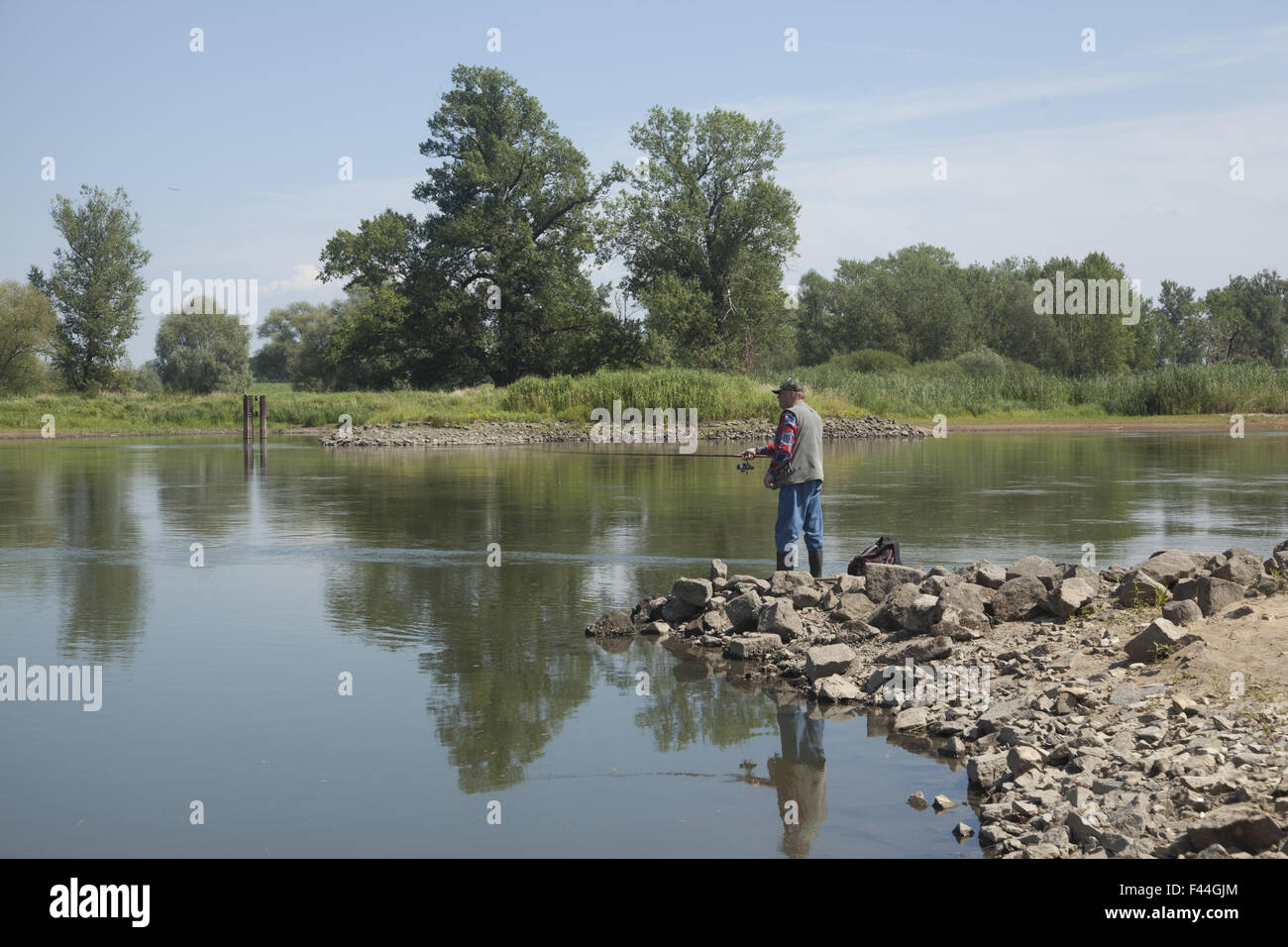 Man fishing on the River Odor the 2nd longest river in Poland. Stock Photo