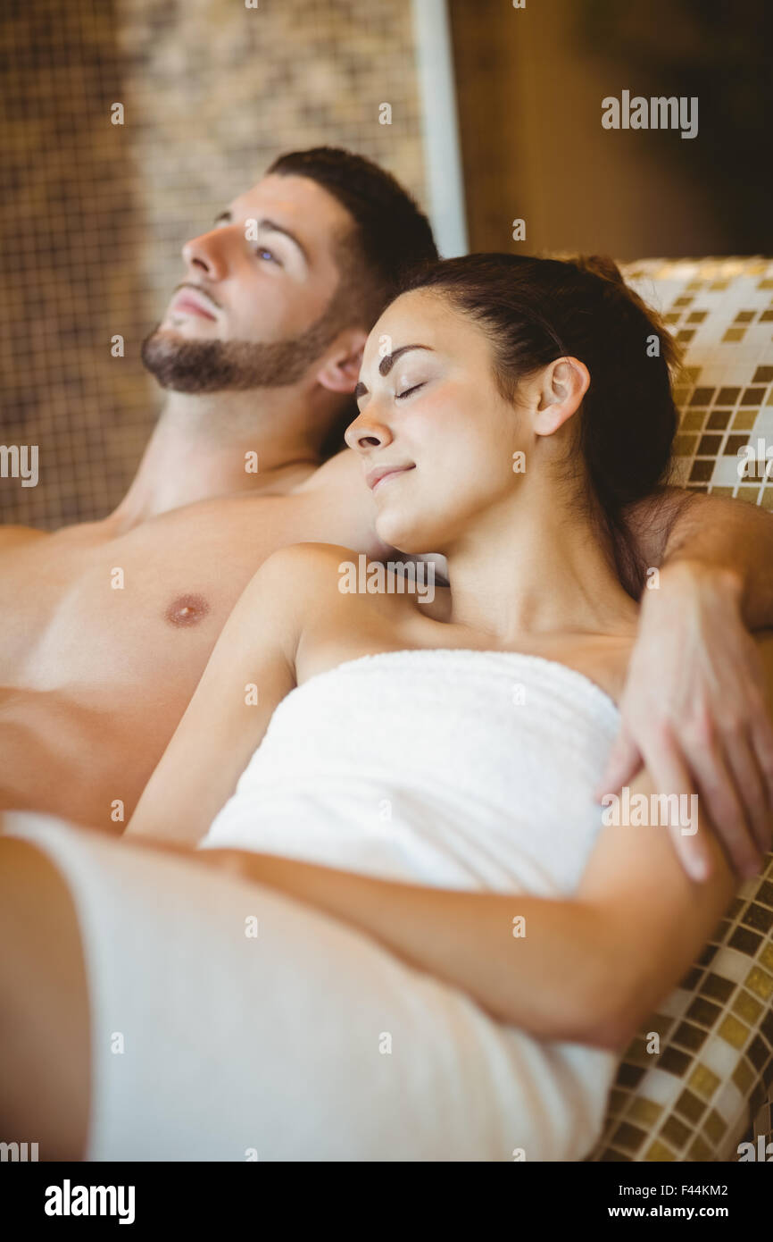 Happy couple lying down together Stock Photo