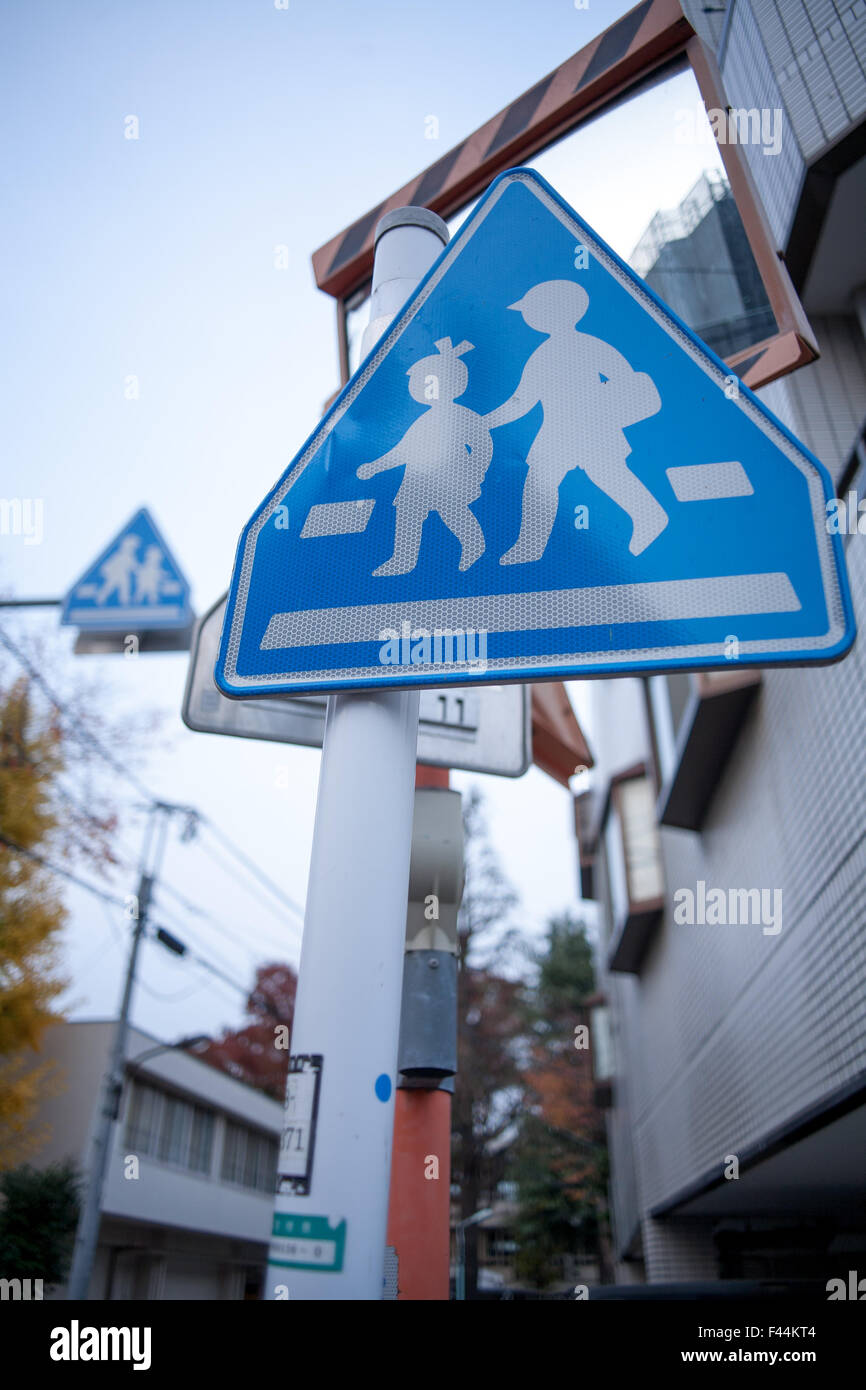 Blue and white child crossing signs Stock Photo