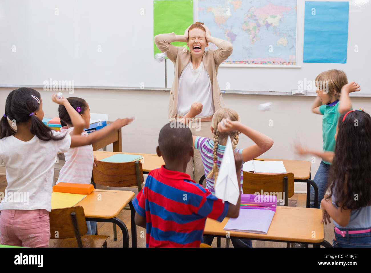 Naughty pupils in class Stock Photo