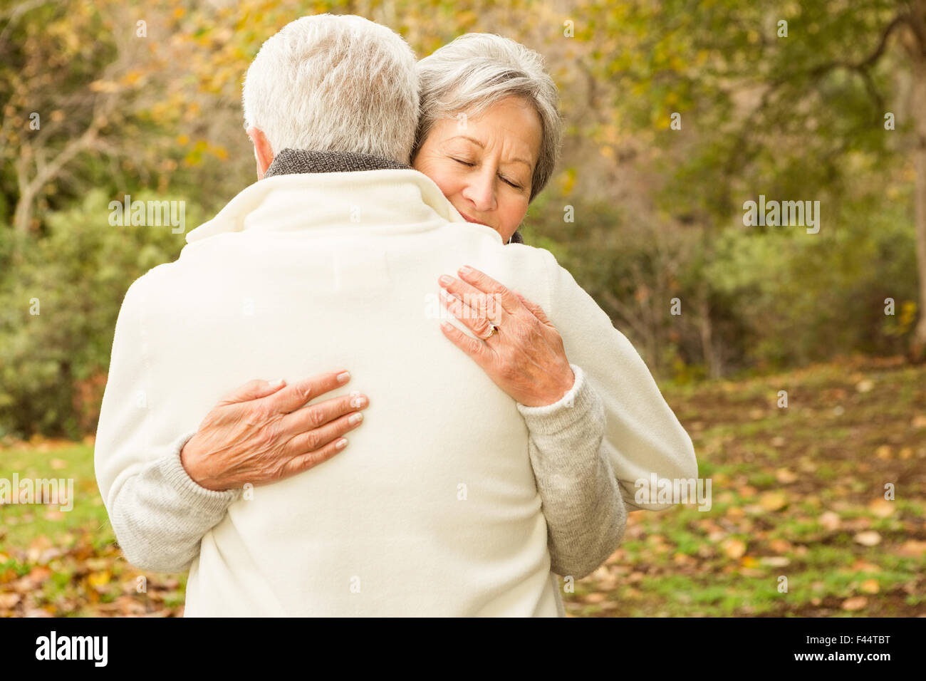 Senior couple in the park Stock Photo - Alamy