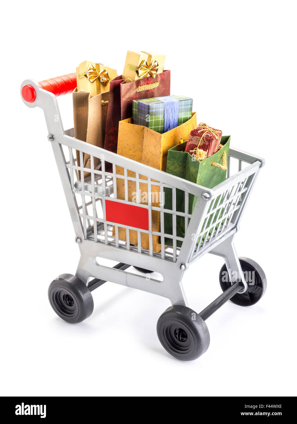 Shopping cart full of bags filled with presents and gifts shot on white Stock Photo