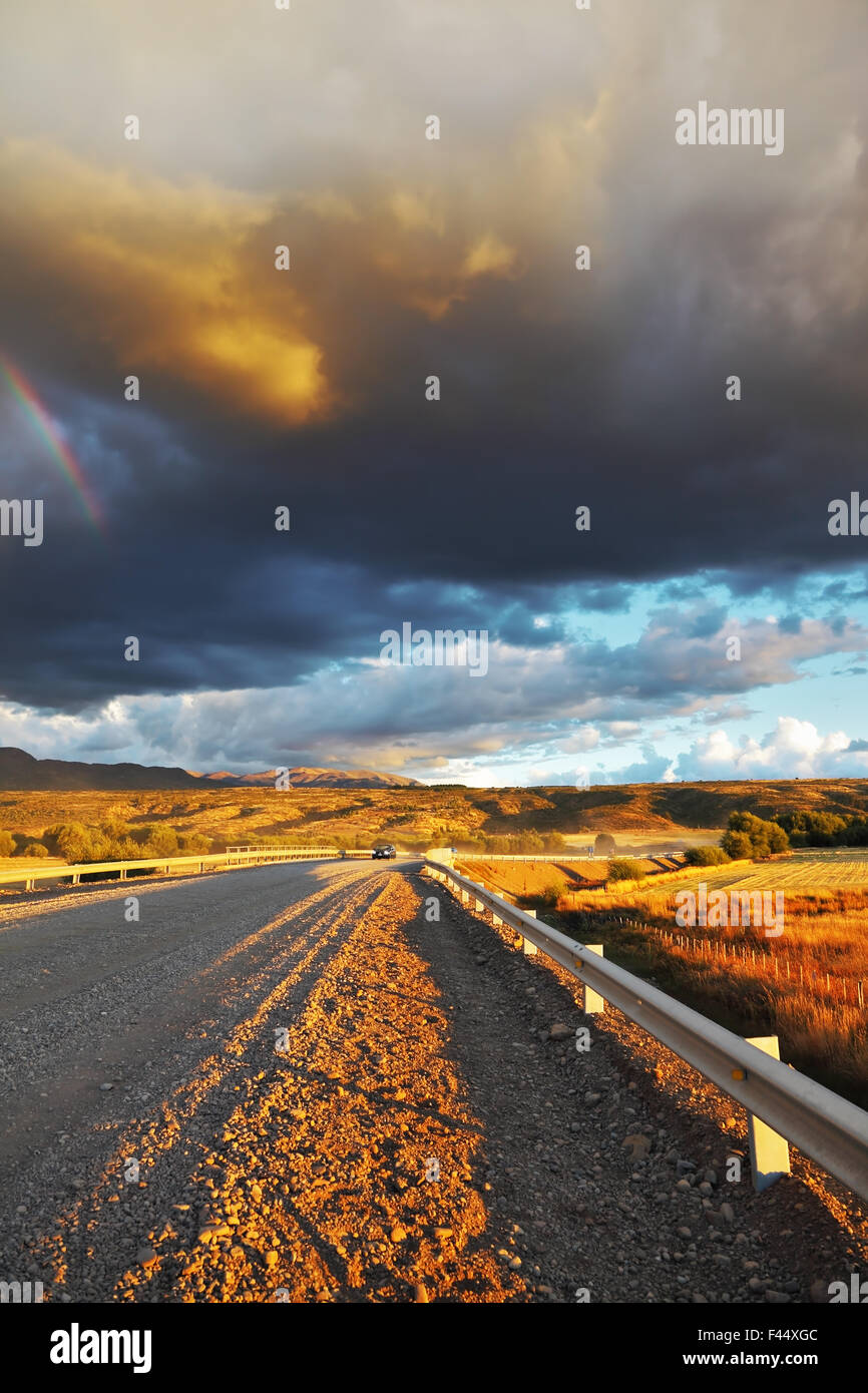 Low swirling cloud and  gravel road Stock Photo