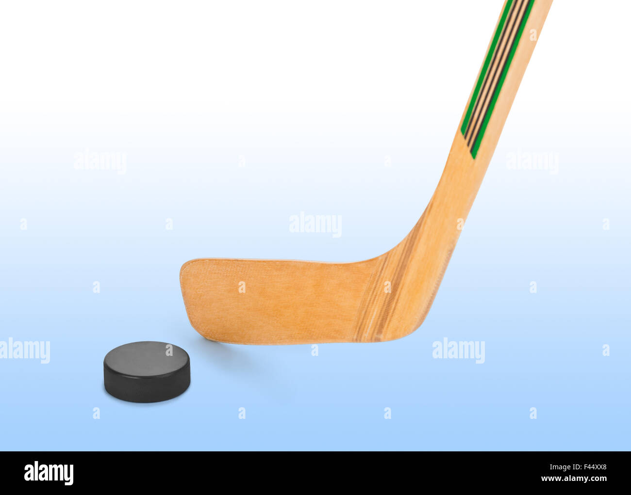 Ice hockey stick and puck Stock Photo Alamy
