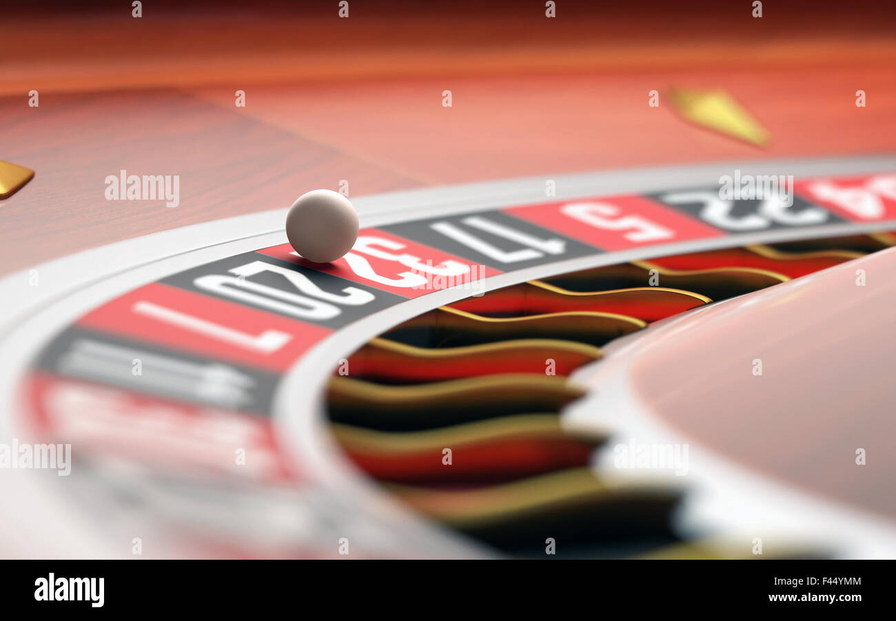 Playing roulette in the casino. Depth of field with focus on the ball. Stock Photo