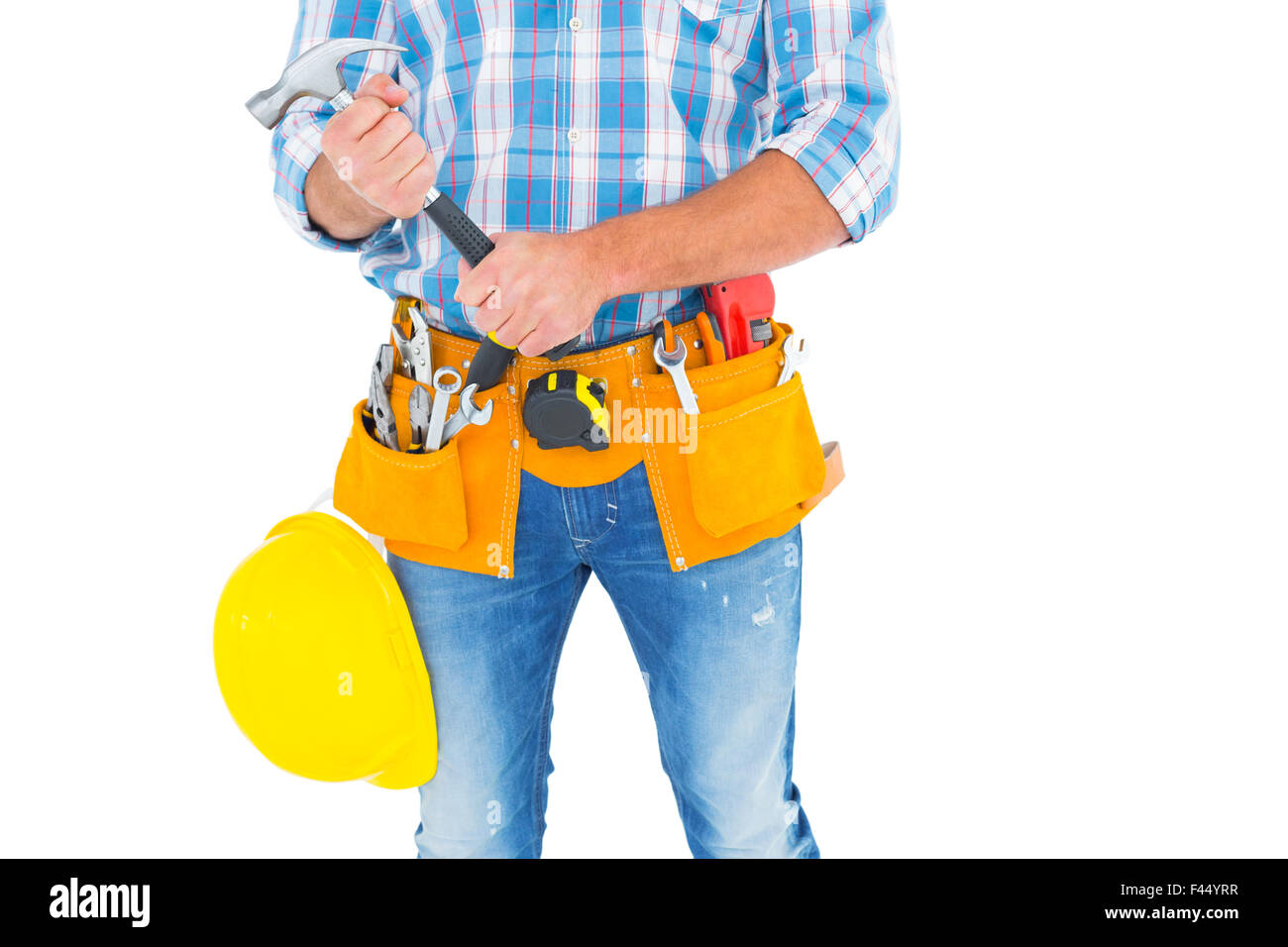 Midsection of manual worker holding hammer Stock Photo