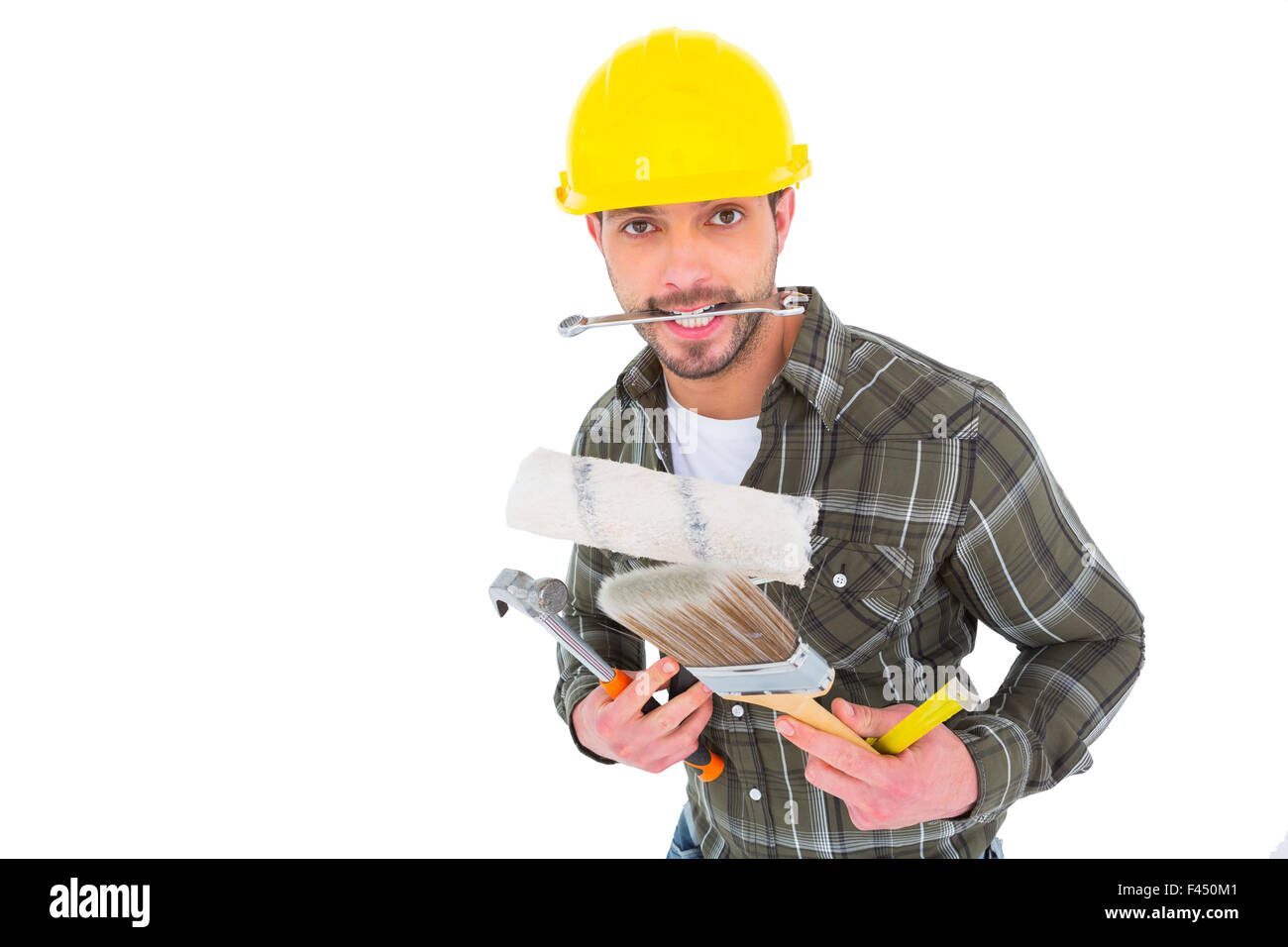 Manual worker holding various tools Stock Photo
