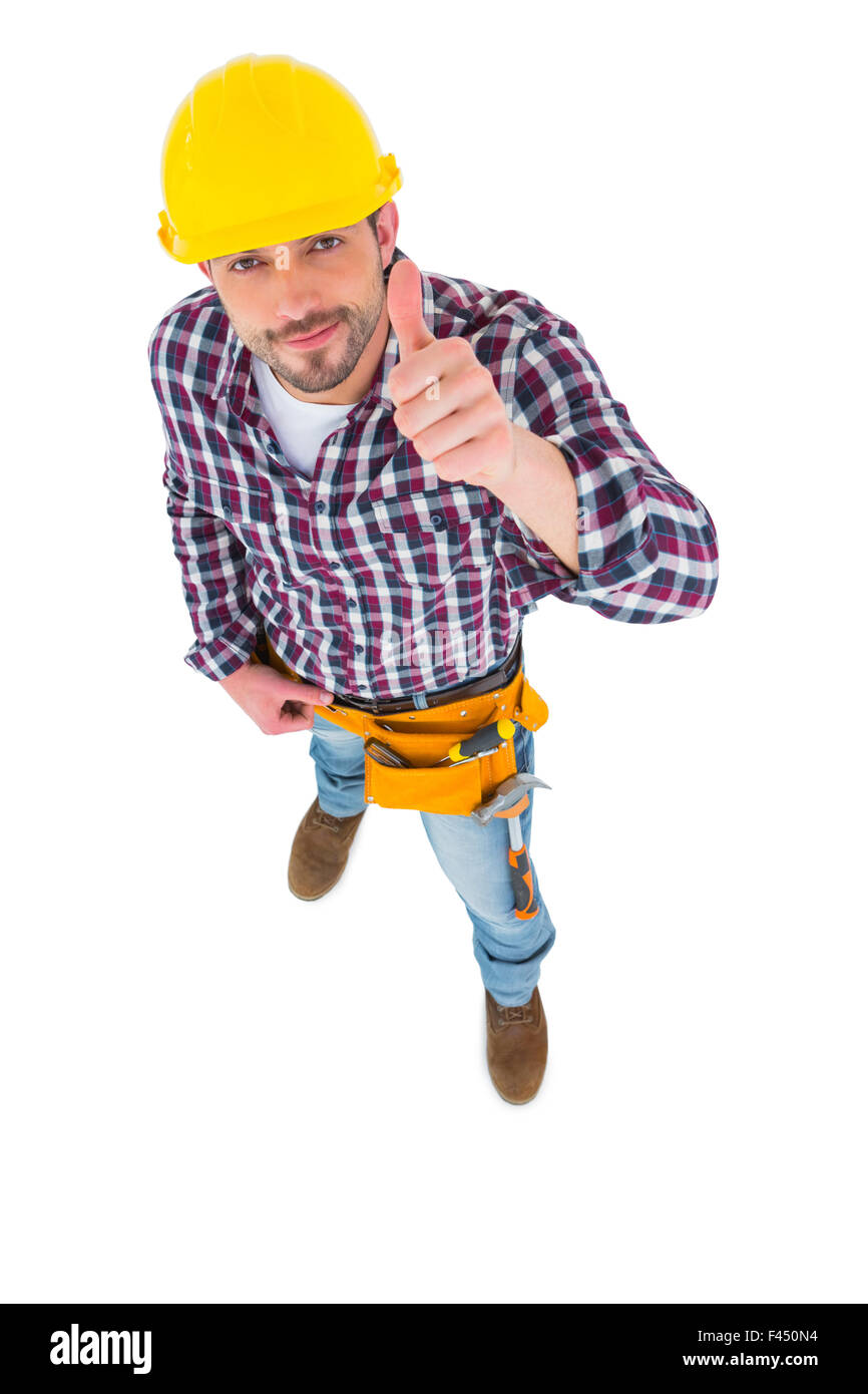 Smiling handyman with thumbs up Stock Photo - Alamy