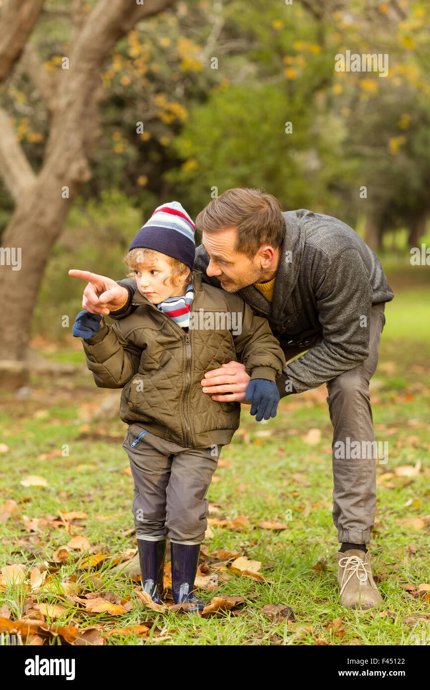 Young father showing something to his cute son Stock Photo