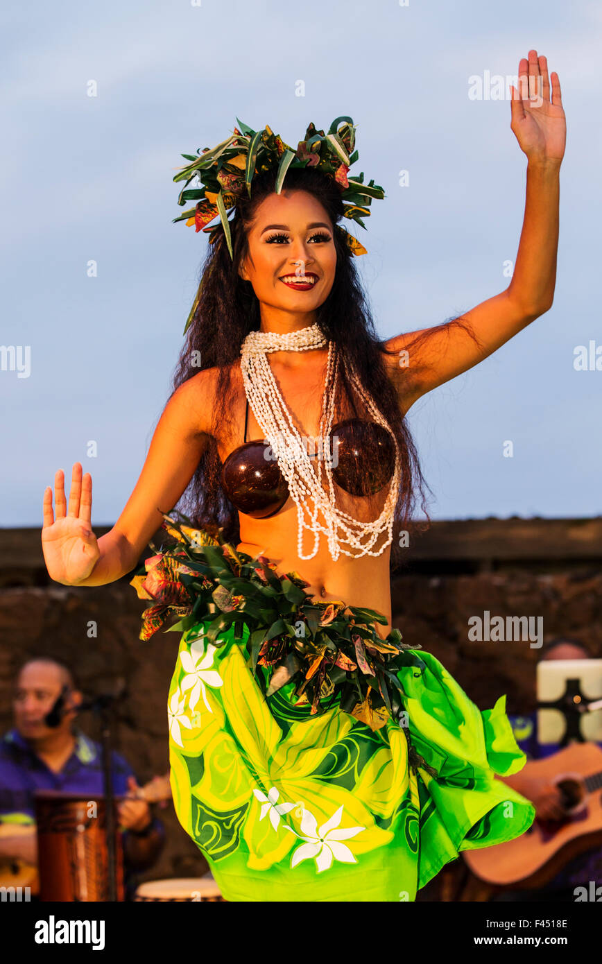 Beautiful young native woman performing traditional dance at Luau, Big Island, Hawai'i, USA Stock Photo